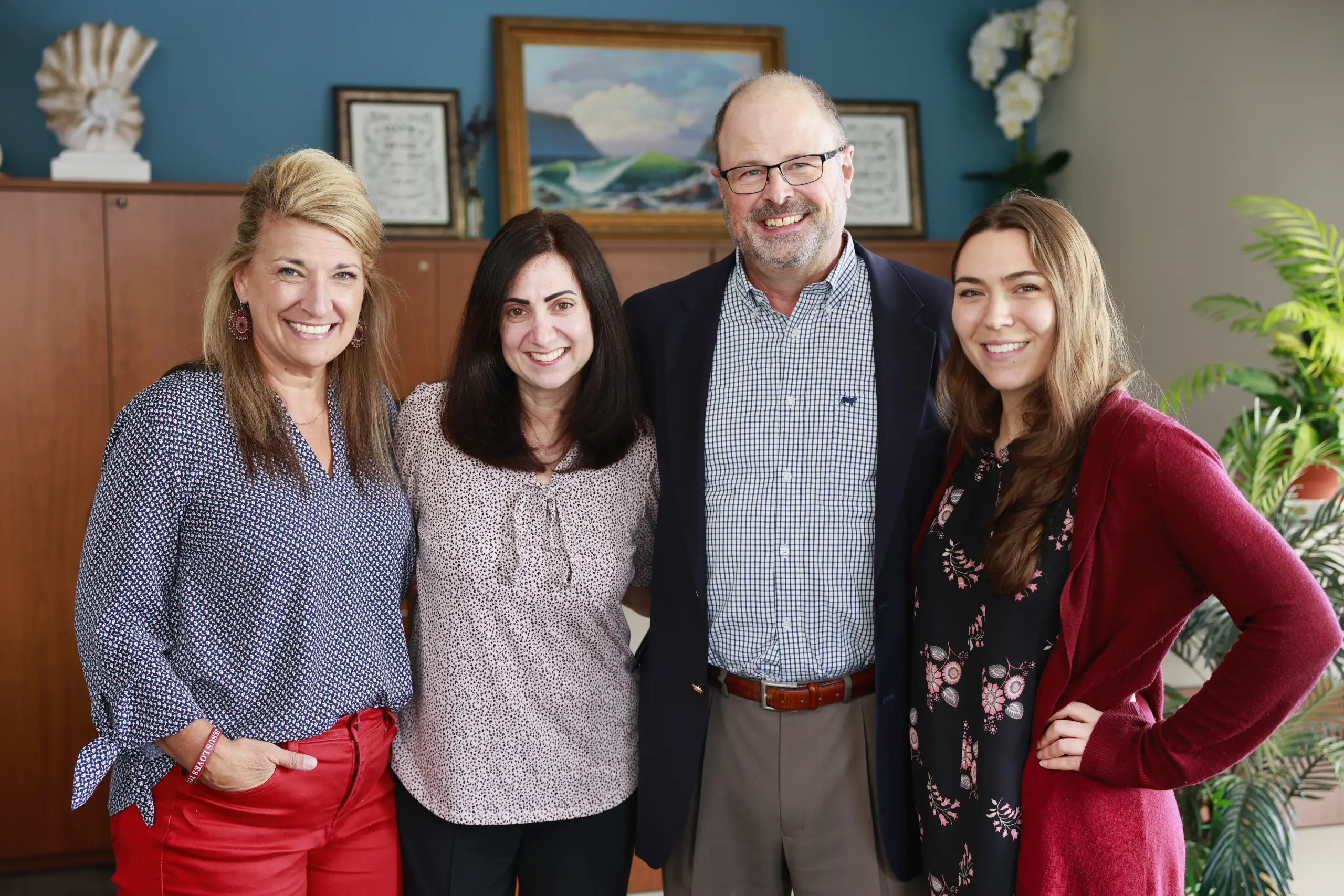 Bowles Hearing Care Services team group photo in clinic